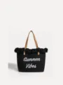 Bolso tote grande de lona negra con asas de cuero marrón y flecos para mujer en la playa. - Negro