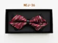 Detail view of a men red and black patterned bow tie neatly packed inside a black gift box. - Red and Black Abstract (NEJ-36)