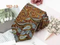 Close-up detail of the elegant brown paisley jacquard men's necktie, showing fabric texture. - YG2-13