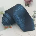 Detailed view of a stylish blue geometric jacquard necktie, perfect for formal business attire. - CDT-14