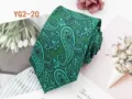 Green paisley jacquard tie detail showing intricate traditional woven pattern and texture. - YG2-20