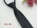 Black zipper necktie detail view, narrow pre-tied business tie featuring subtle textured pattern. - L6L-06
