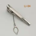 Silver metal tie clip detail, elegant business accessory with safety chain and sparkling crystal. - LJ-04