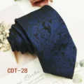 Detailed view of a classy blue and black paisley necktie, perfect for formal business wear. - CDT-28