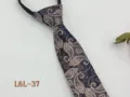 Detail view of a pre-tied zipper necktie featuring a classic paisley pattern in deep blue. - L6L-37