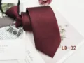 Burgundy textured zipper tie close-up, premium fabric detail shot showing fine shimmer texture. - LD-32