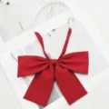 Red JK uniform bow tie with adjustable strap, classic pre-tied ribbon for school girls. - Red