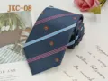 Classic navy blue JK uniform necktie featuring stylish striped pattern and crown embroidery details. - JKC-08