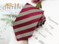 Detailed view of the red and white striped JK necktie, featuring a classic handmade design. - JKC-14