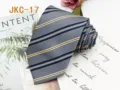 Close-up detail of the classic striped JK uniform necktie, featuring fine jacquard texture. - JKC-17