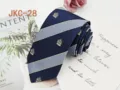 Detailed view of 7cm JK uniform striped necktie with elegant crest embroidery for stylish wear. - JKC-28