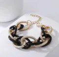 Klobiges Kettenarmband mit goldenen strukturierten und schwarzen Gliedern, Retro Schmuck. - Goldschwarz