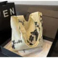 Beige canvas tote bag with black lace butterfly embroidery, stylish large capacity shoulder bag for women. - White & Black