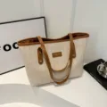 Woven straw tote bag for women, large capacity commuter shoulder bag with PU leather handles. - Brown