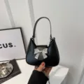 Borsa a mano nera alla moda con fiocco argento, elegante borsa a spalla per donne chic. - Taglia S / Nero