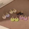 Detailed view of colorful acetate round earrings with elegant gold metal top connectors for women. - Brown 18