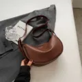 Brown PU leather crescent shoulder bag, stylish casual dumpling crossbody bag for women. - Coffee