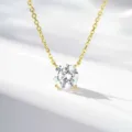Close-up shot of a classic four-prong solitaire pendant necklace showcasing brilliant cut stone. - 3 Carat Rhinestone (XL148) / Gold