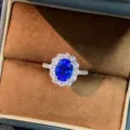 Close-up detail of a stunning royal blue sapphire ring with sparkling halo diamonds. - Size 5 / Royal Blue (PYJZ030)