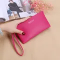 Portefeuille long rose pour femme avec fermeture éclair et dragonne, pochette quotidienne élégante. - Magenta