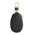 Mini etui cle de voiture en cuir noir avec crochet metallique dore et fermeture eclair. - Noir