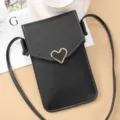 Black PU leather crossbody phone bag with metal heart buckle and white stitching detail. - Black