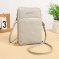 Borsa a tracolla trapuntata grigia per cellulare con zip multiple e ricamo. - Grigio