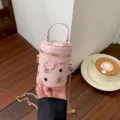 Pink mini cylindrical crossbody bag with bear monogram pattern, cute leather purse with chain. - Pink