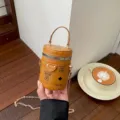 Cute mini cylindrical bucket bag for kids, stylish PU leather crossbody purse with chain. - Dark Brown
