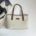 Canvas tote bag with brown leather handles and casual commuter style for women variant. - No Pendant / Brown