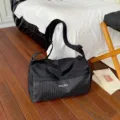 Large capacity travel duffel bag for women, lightweight gym and sports weekend bag in black. - Black
