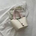 Chic beige bucket bag with pink top handles, stylish leather shoulder bag for women. - White and Pink