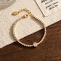 Detailed shot of a delicate gold-toned zircon bracelet with sparkling stones and a branded tag. - Gold Full Pave Style (2304QT21378SL)