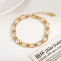 Gold-tone interconnected geometric link bracelet with bead accents, elegant daily wear. - Geometric Chain Style