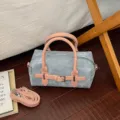 Blue denim pillow handbag with pink leather handles and strap for stylish everyday wear. - No Pendant / Pink