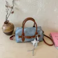 Chic grey denim barrel shoulder bag with brown leather handles, crossbody strap and star charm. - With Pendant / Brown