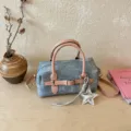 Chic niche design women's barrel shoulder bag with stylish pink straps and star pendant. - With Pendant / Pink
