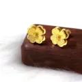 Frosted four-leaf clover stud earrings, detailed view showing exquisite matte texture. - Frosted Clover / Gold