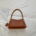 Minimalist brown leather shoulder bag, chic underarm bag for women daily commute style. - Brown