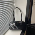 Black patent leather shoulder bag for women, chic pillow handbag with pearl bow charm. - Black With Pendant