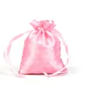 Premium pink satin drawstring pouch with smooth silk texture for gift packaging. - Pink