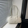 Minimalist off-white shoulder bag, PU leather casual handbag and elegant pillow bag variant. - White Without Pendant