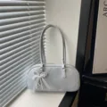 Stylish grey patent leather shoulder bag with elegant pearl bow pendant for daily commute. - Blue with Pendant