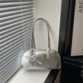 Silver metallic shoulder bag for women, trendy pillow handbag with elegant pearl bow pendant. - Silver with Charm