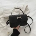 Black straw crossbody bag, stylish woven shoulder bag with metal lock and top handle. - Black