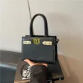 Black PU leather handbag, elegant fashion top handle shoulder bag with metal buckle and letters. - Black