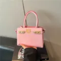 Pink stylish top handle shoulder bag for women, chic PU leather handbag with gold hardware. - Pink