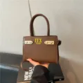 Stylish brown PU leather handbag for women, chic shoulder bag with metal accents and handle. - Dark Brown