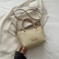 Woven straw bucket bag with PU leather handle and crossbody strap for beach summer style. - Khaki