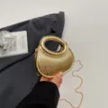 Gold metallic crescent evening bag with round top handle and chain strap for women party dress. - Gold
